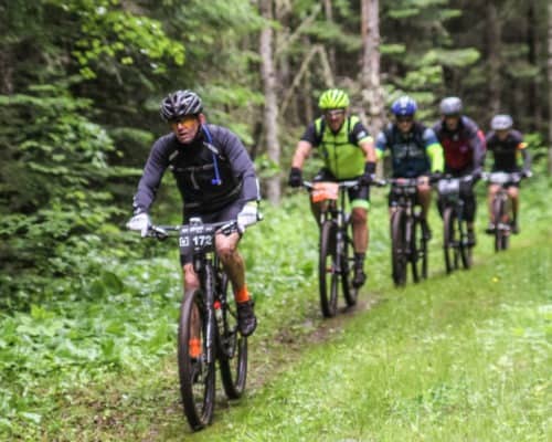 Lutsen 99er Bikers Cutting Through the Mud