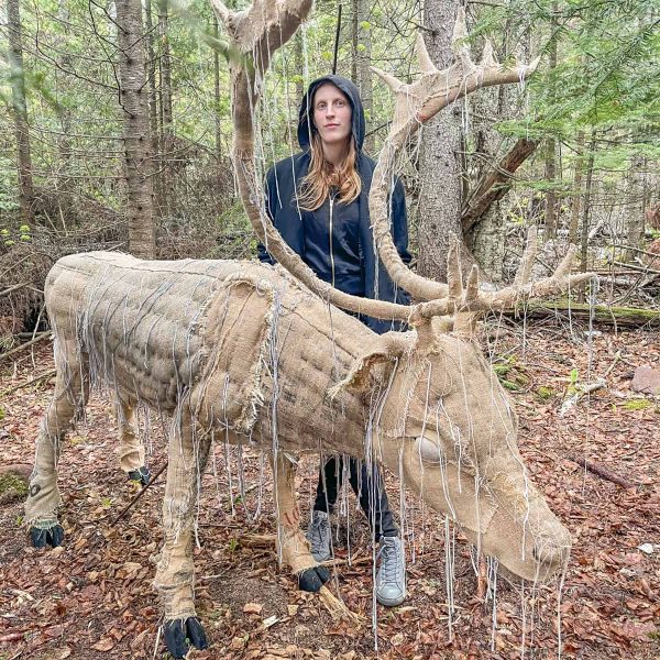 Corrie Steckelberg with her woodland caribou "Once and Future" art installation